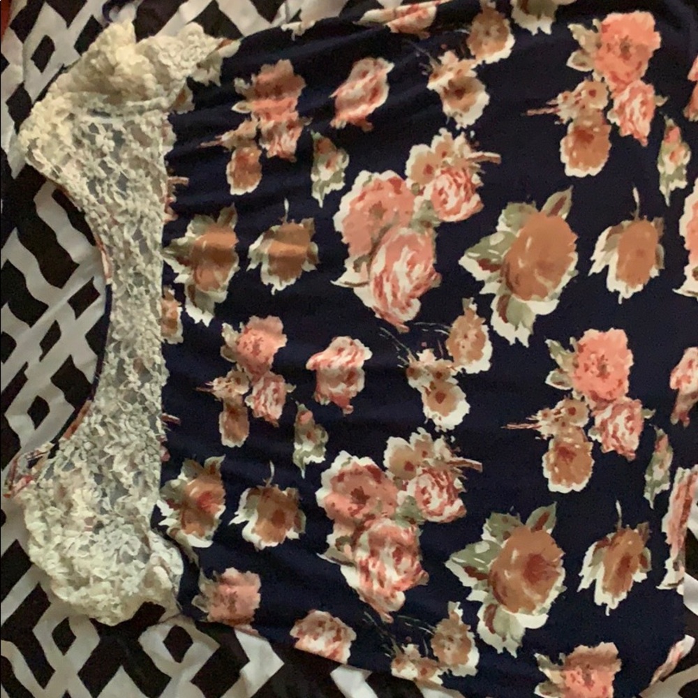 It’s a Floral short sleeve shirt with lace